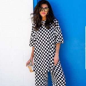 Dressed in Lala Lex Ribbed Playsuit in Black + White Checkerboard Size large